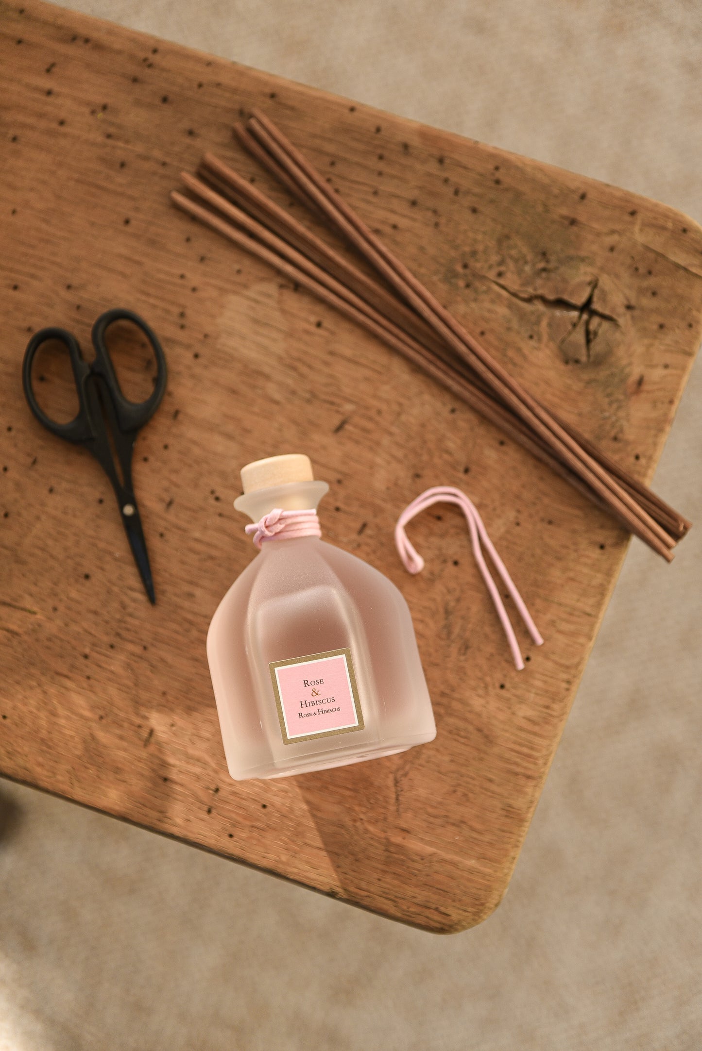 Rose & Hibiscus Reed Diffuser, on table