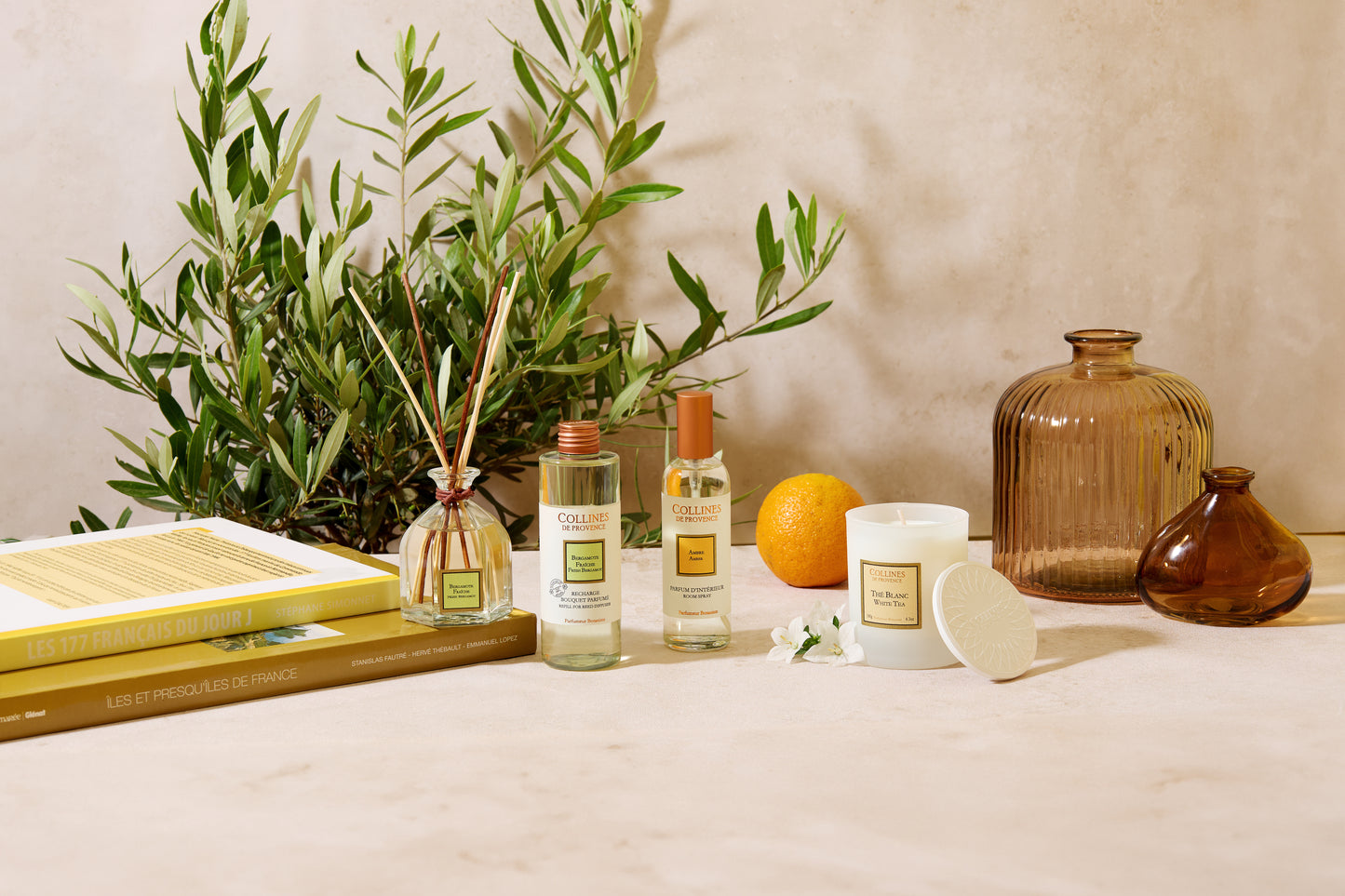 Fresh Bergamote Reed Diffuser, with other collections on a table
