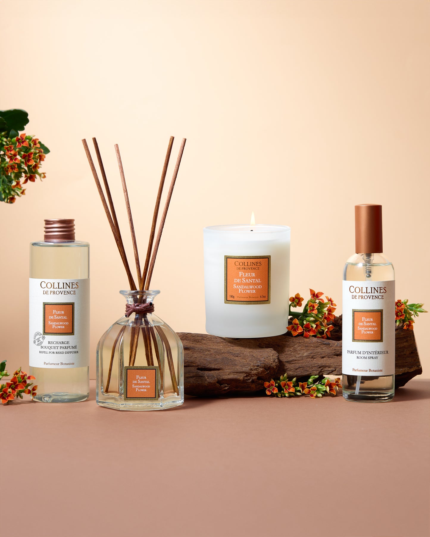 Collines de Provence Sandalwood collection of diffuser, candle, room spray, and refill, with a beige background