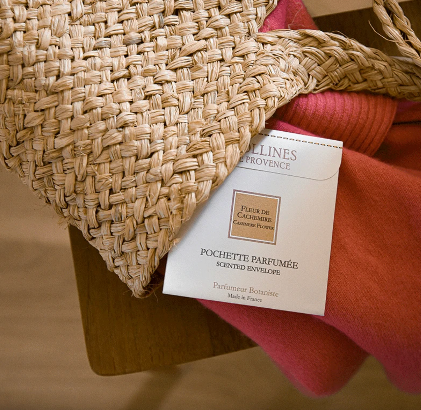 Woven basket with a scented envelope labeled Collines De Provence Cashmere Flower