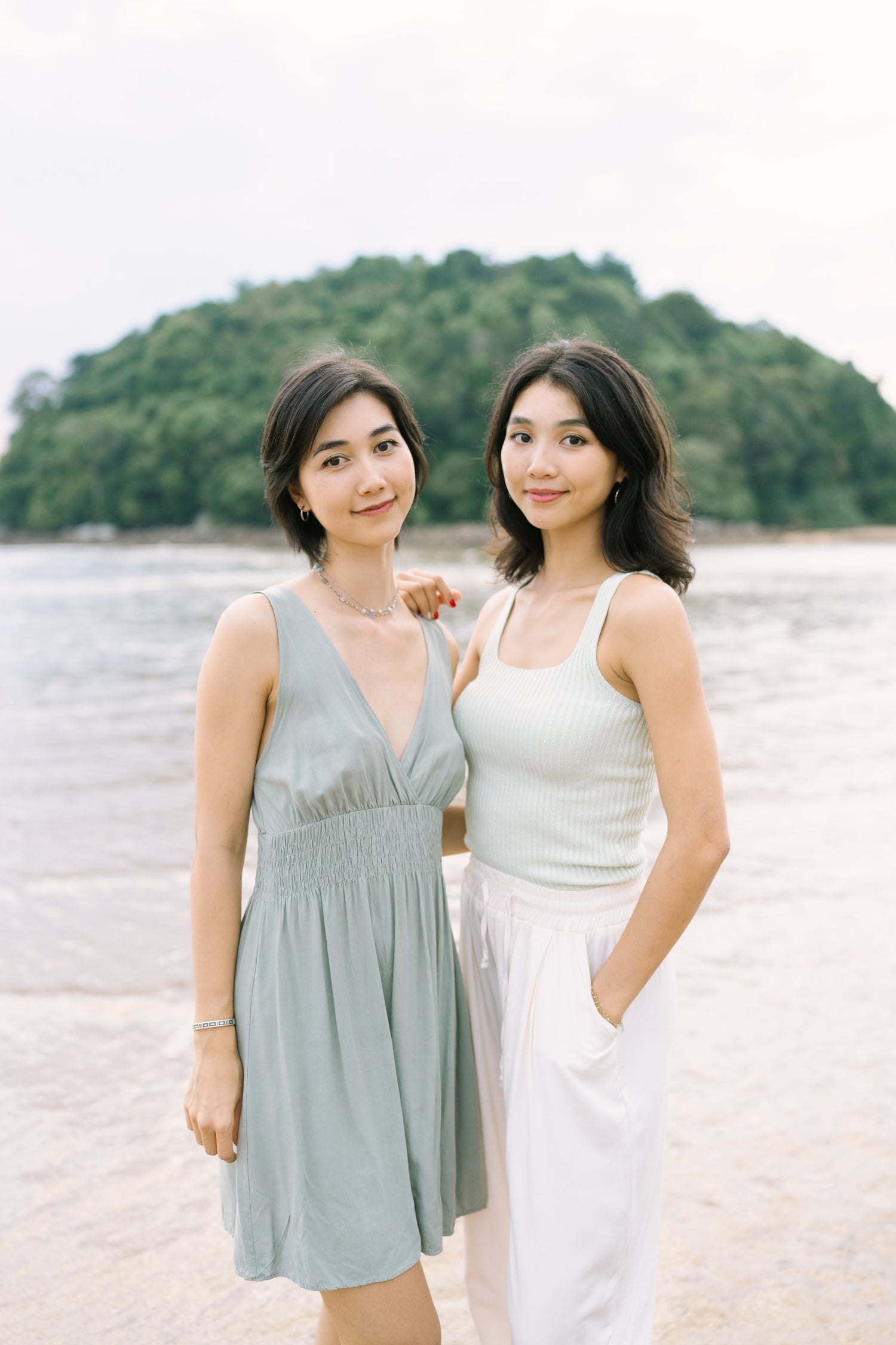 Sophie and Charlene standing next to sea