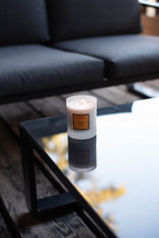 Amber Scented Candle, on a glass table