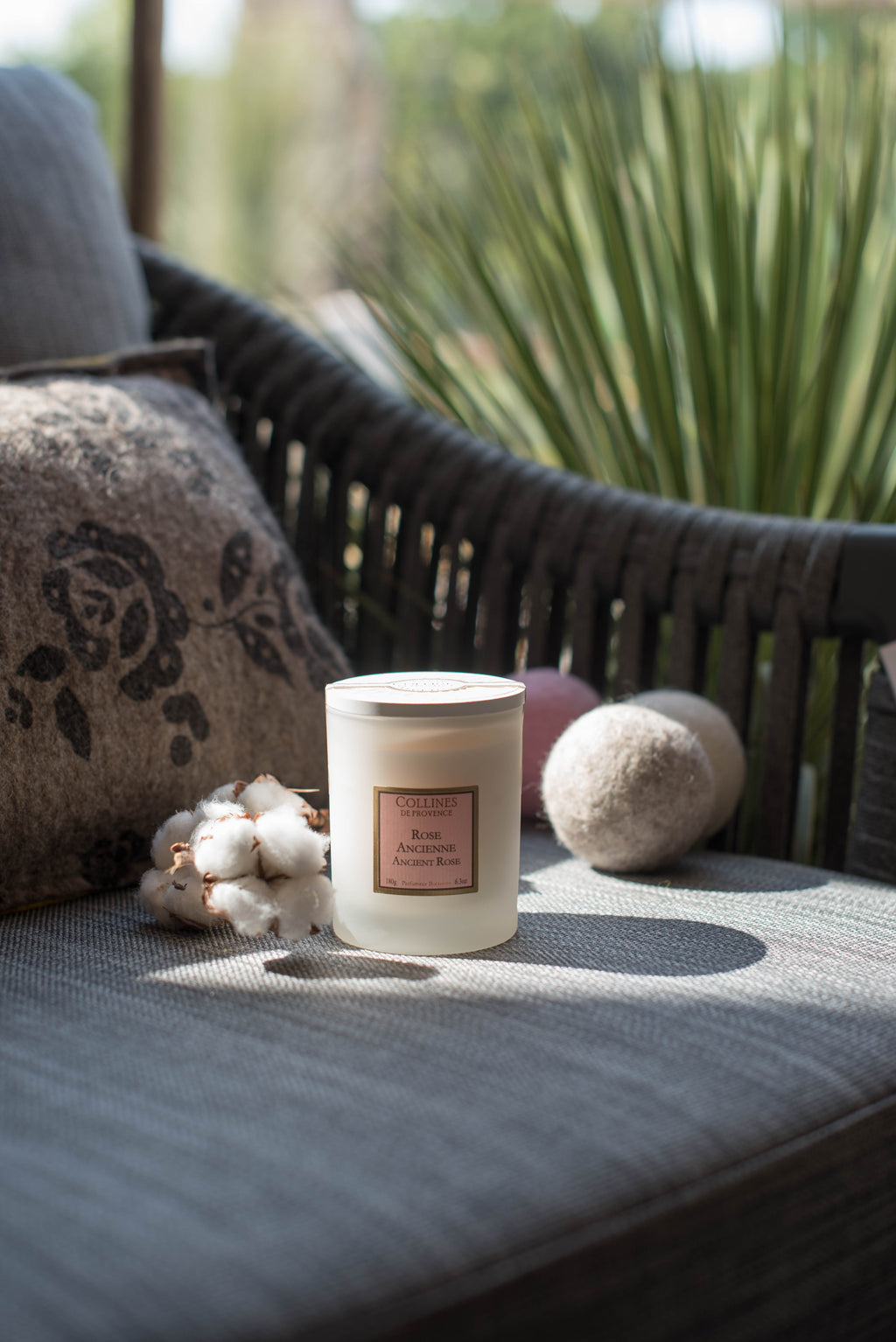 Collines de provence scented candle, on a sofa