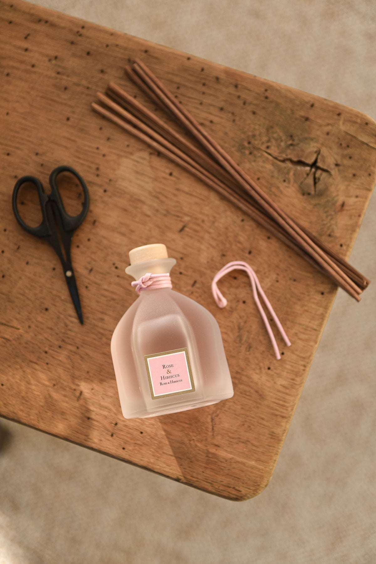 Rose & Hibiscus Reed Diffuser, on table
