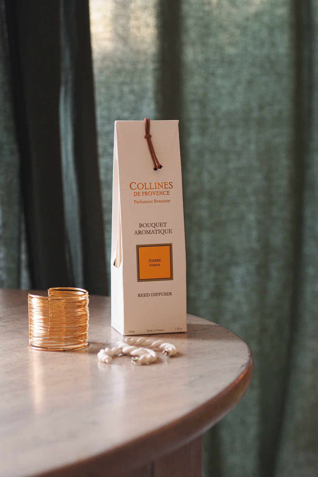 Amber Reed Diffuser box, on a table