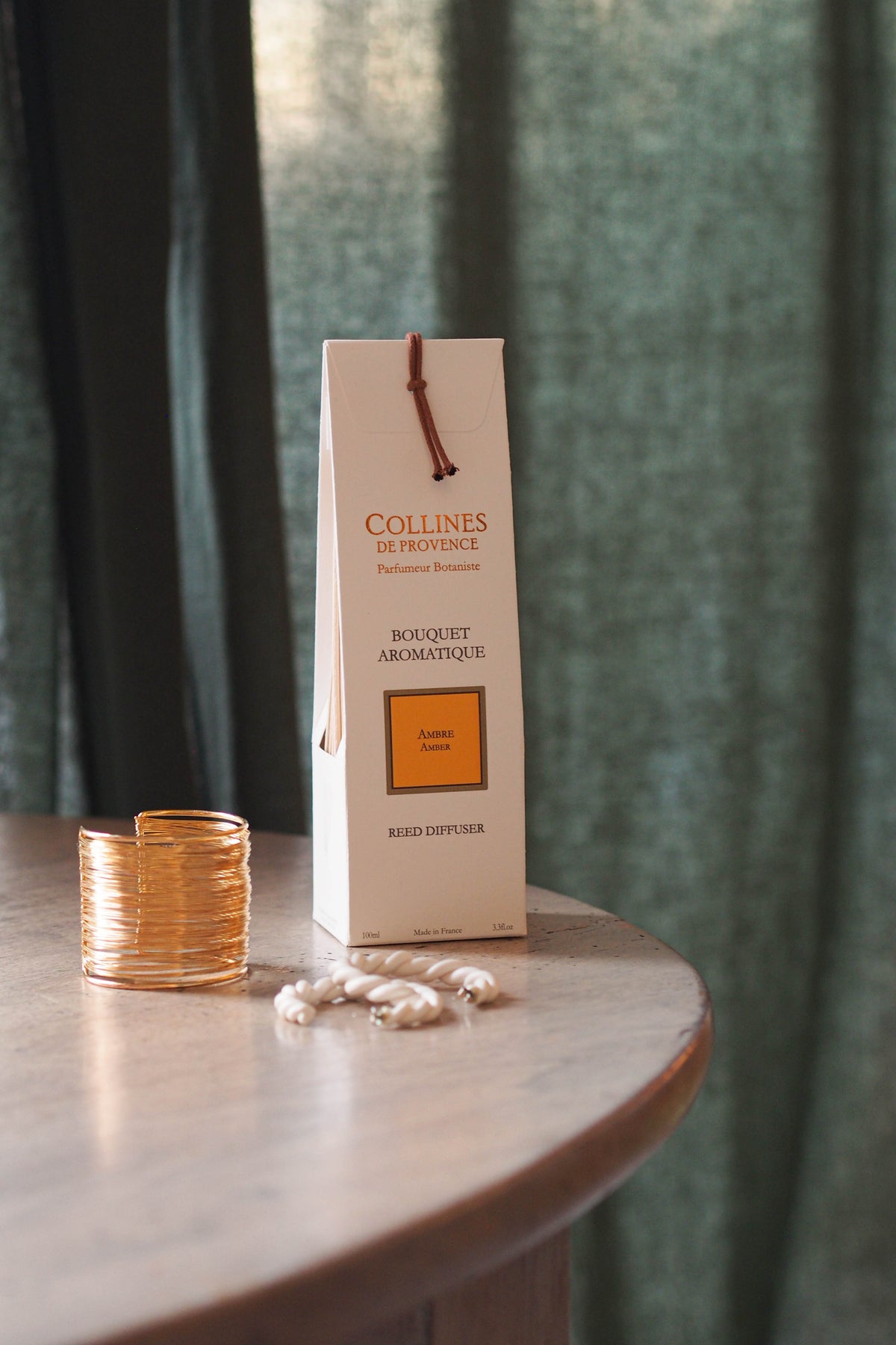 Amber Reed Diffuser box, on a table