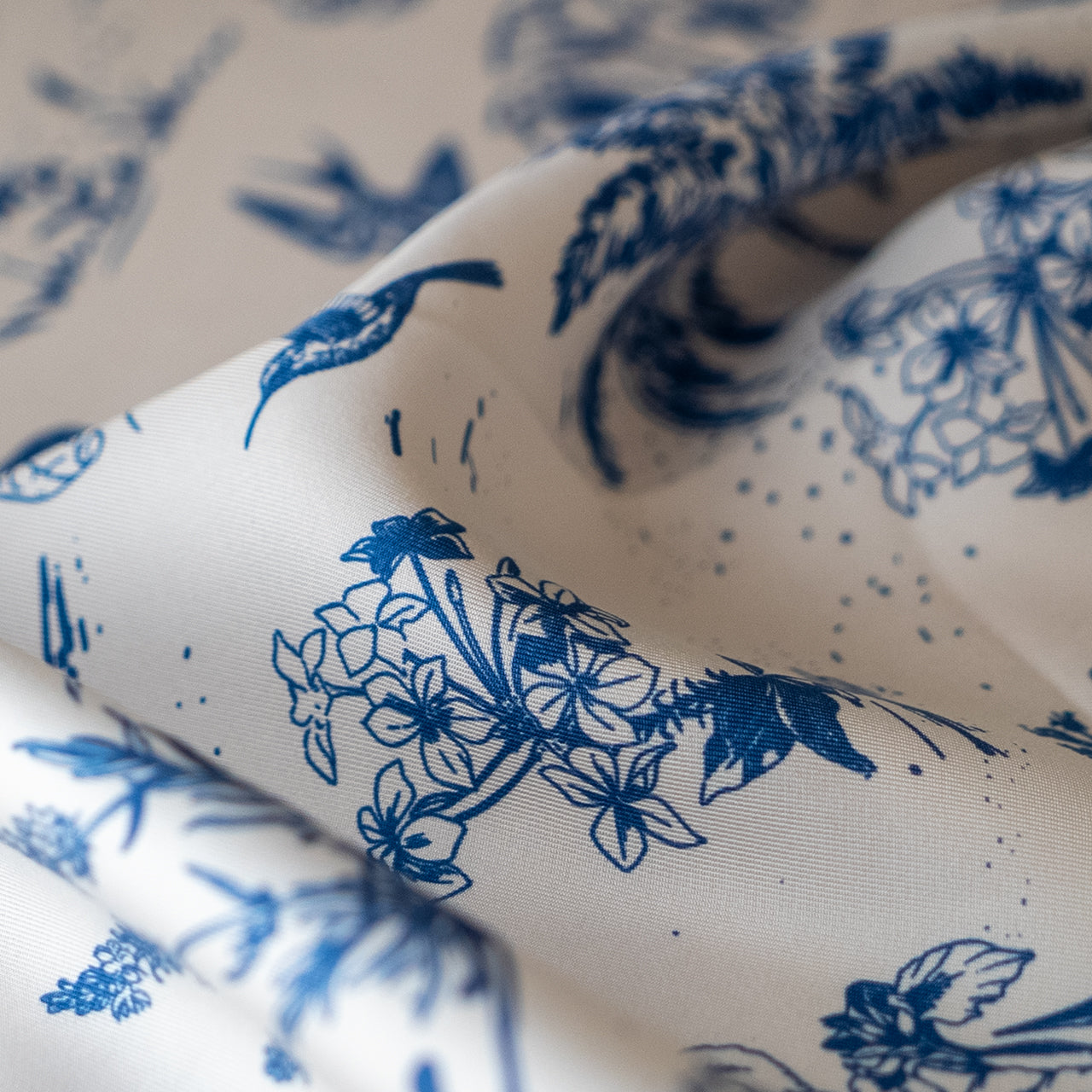 Close-up of silk scarf with blue floral pattern