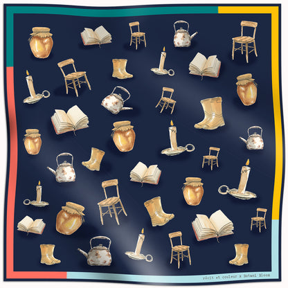 Patterned scar with illustrations of books, chairs, boots, and other objects on a dark blue background.