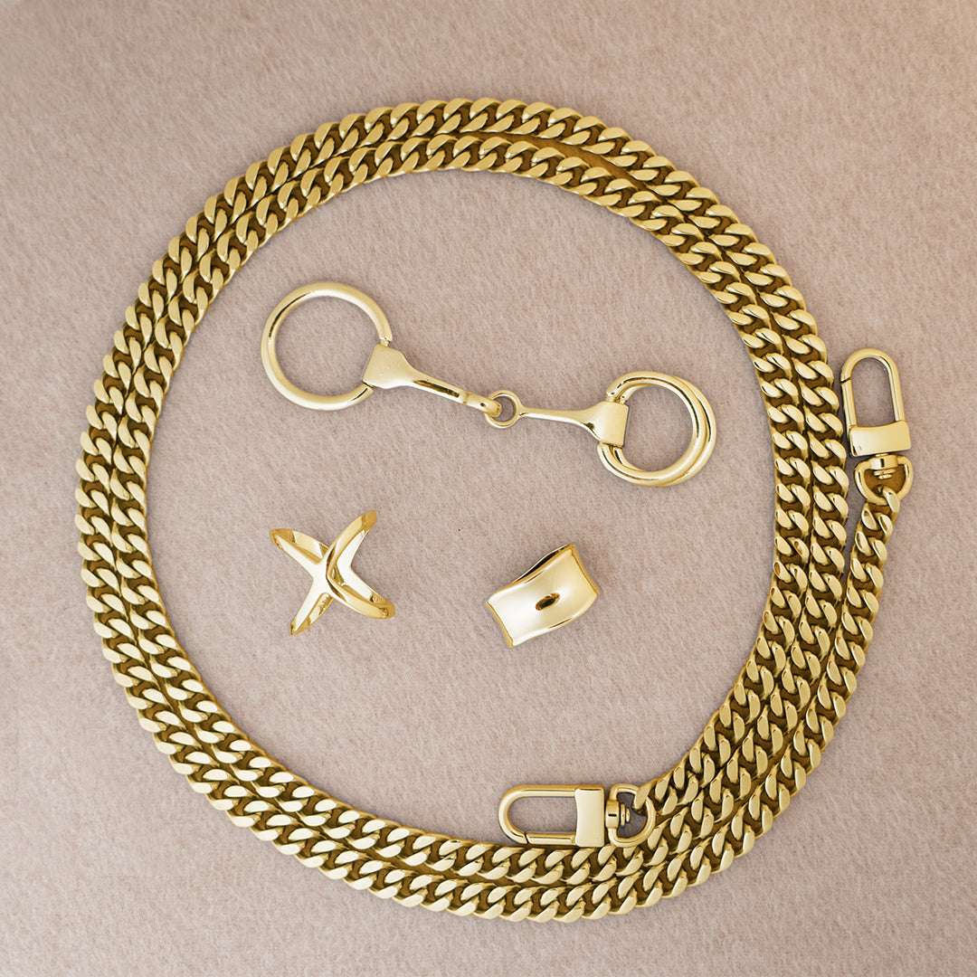 Botani Bloom silk scarf accessories including a Gold chain with clasps on a beige background