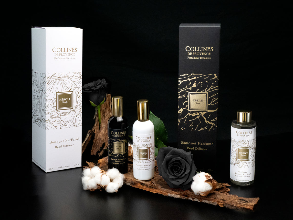 Collines de Provence room spray and diffuser refill bottles and packaging on a dark background