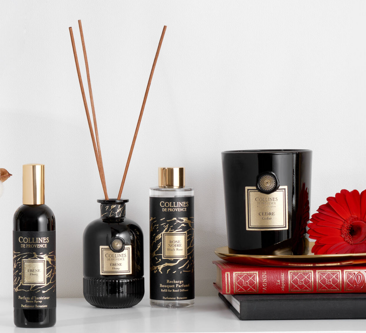 Collines de Provence fragrance products including a candle, diffuser, room spray, and diffuser refill on a white surface