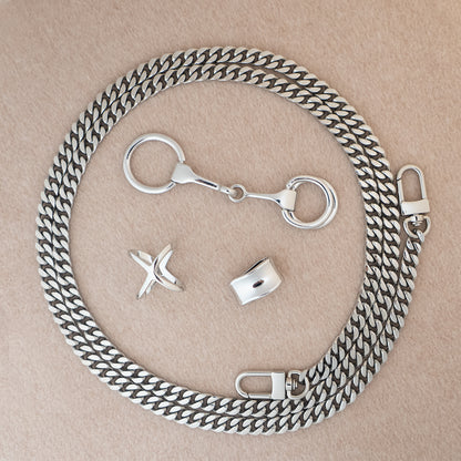 Botani Bloom silk scarf accessories including a silverchain with clasps on a beige background