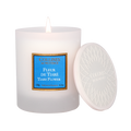 Collines de Provèence tiare flower scented candle with lid on a white background