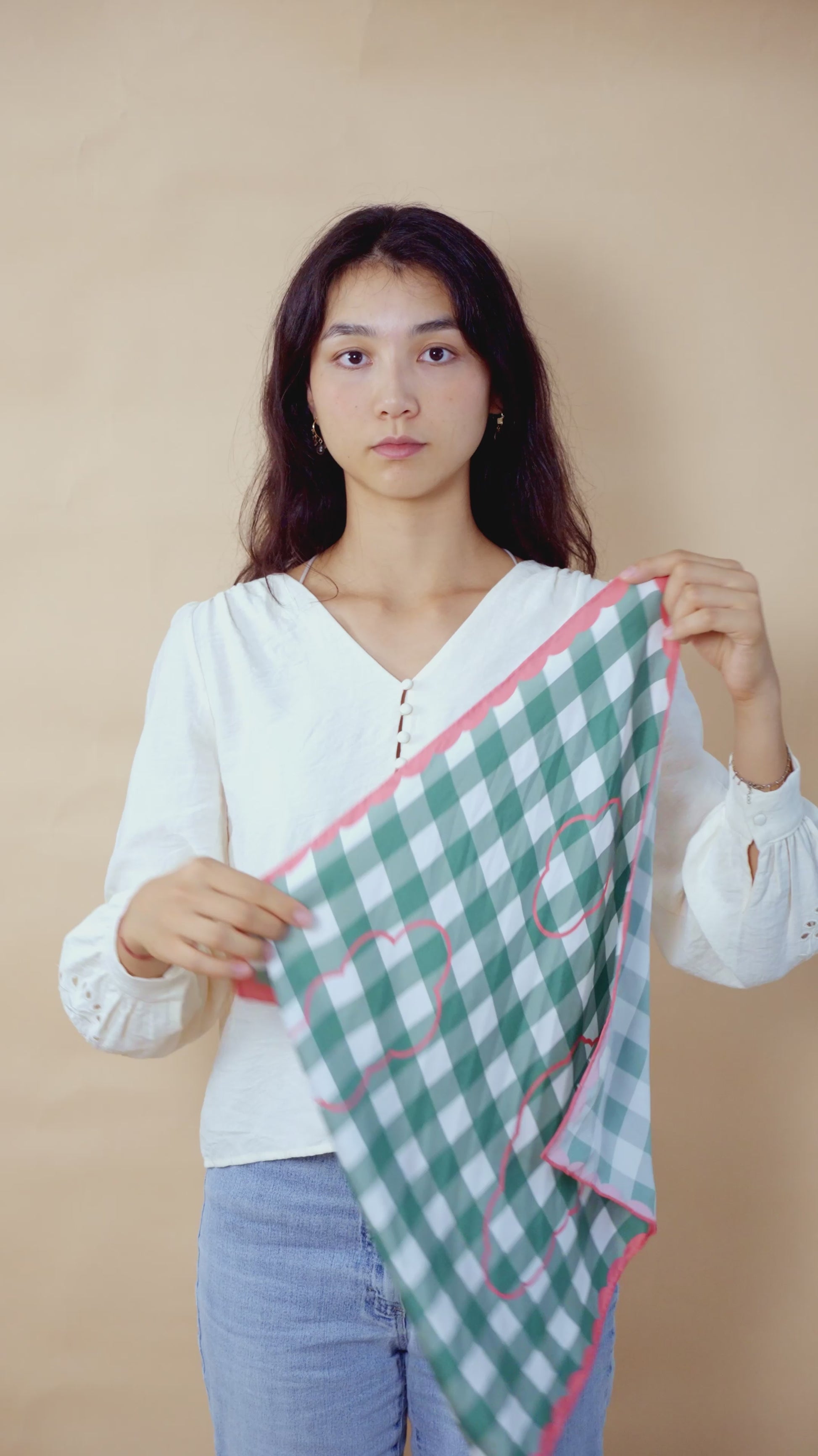 Video tutorial of a woman styling a botani bloom scarf