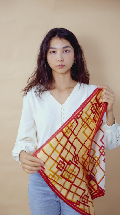 Video tutorial of a woman styling a labyrinth oriental scarf